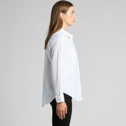 A white button-up shirt with a collar and long sleeves, displayed on a model from the side.