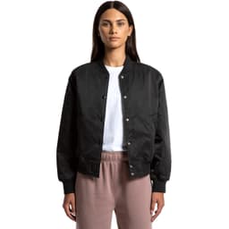 A black varsity bomber jacket with a snap button front, worn by a model. Features a logo on the chest.