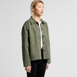 A green chore jacket with a collared neckline and button-up front, featuring a chest pocket and a casual fit.