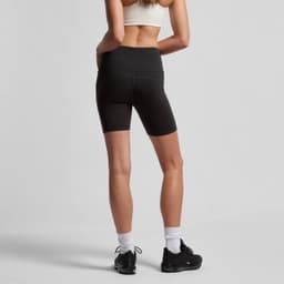 Black active bike shorts with a high waistband, featuring a logo, worn by a model from the back.