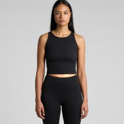 A black active crop tank top displayed on a model, featuring a form-fitting design and a subtle logo.