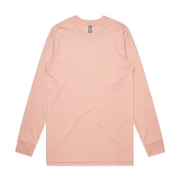 A long-sleeve t-shirt in a soft peach colour, featuring a branded label.