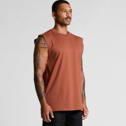 A man displaying a rust-coloured classic tank top with sleeveless design and a subtle logo.