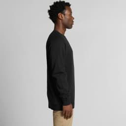 A black jumper with long sleeves, featuring a side view of a person wearing it. The product includes a logo.