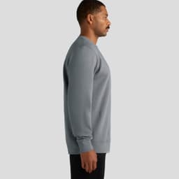 A grey hoodie is displayed on a male model, showcasing a side view. The hoodie features long sleeves and a rounded neckline.