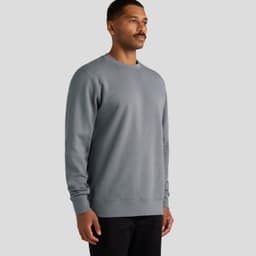 A grey jumper features a classic crew neckline and long sleeves, displayed on a male model. It includes a logo.