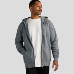 A grey zip-up hooded jumper featuring a front pocket and a casual fit, worn over a white T-shirt. It has a logo.