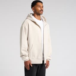 A beige heavy zip hoodie with a full zip and front pockets, worn by a model against a plain background.