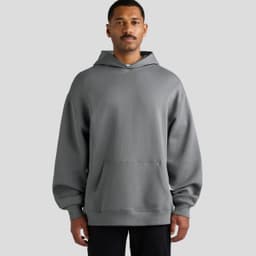 A grey hooded sweatshirt with a front pocket, featuring a relaxed fit and long sleeves. It has a logo on the sleeve.