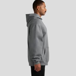 A grey hoodie with a kangaroo pocket, featuring a hood and loose fit, shown from the side. It has a logo on it.