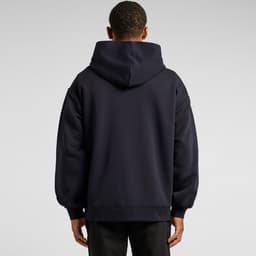 A dark navy hoodie with a large hood, featuring a relaxed fit and long sleeves. The back view showcases its simple design.