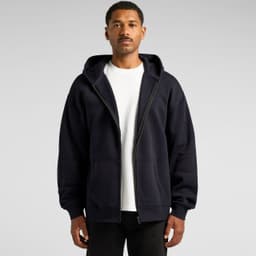 A navy zip-up hoodie with a hood and front pockets, worn by a model. Includes a logo on the garment.