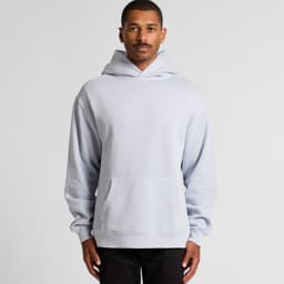 A light blue hoodie with a front pocket and a large hood worn by a model. The hoodie features a logo.