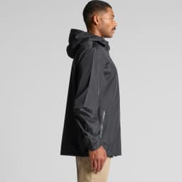 A black rain jacket with a hood, featuring a side zip pocket and a logo on the sleeve.