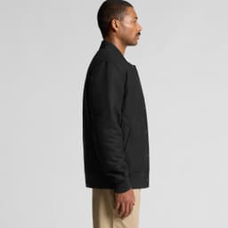 A black felt bomber jacket featuring a button-up front and ribbed cuffs, displayed on a model from the side.