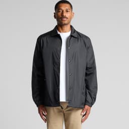 A black coach jacket with a front snap closure and a relaxed fit, featuring a logo on the chest.