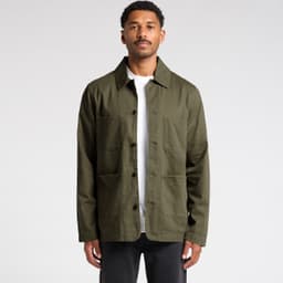 An olive green chore jacket with multiple pockets, featuring a collared neckline and button-up front. It has a logo.