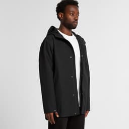 A black rain jacket with a hood, featuring a front zip and snap closures, displayed on a model.