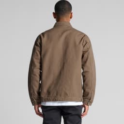 A heavy canvas jacket in brown, featuring a simple design and a logo on the back.