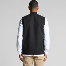 A black heavy vest with a clean back design, worn over a long-sleeve white top. Features a logo.