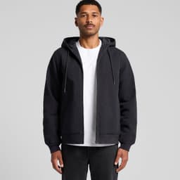 A black canvas bomber hood jacket with a zip front and drawstring hood, worn over a white t-shirt.