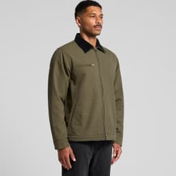 A man wearing an olive green Canvas Cord Collar Jacket with a black collar, featuring a zipped pocket.