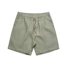 Linen dress shorts in a muted green shade, featuring an elastic waistband and drawstring.