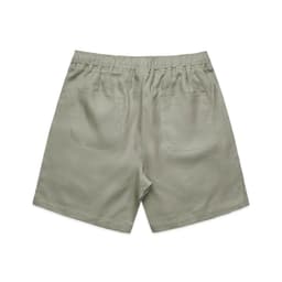 Linen shorts in a soft green hue, featuring a relaxed fit and two back pockets.