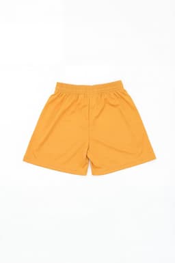 A pair of yellow sports shorts with an elastic waistband and no visible branding.