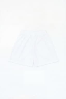 A pair of white sports shorts with an elastic waistband and a logo.