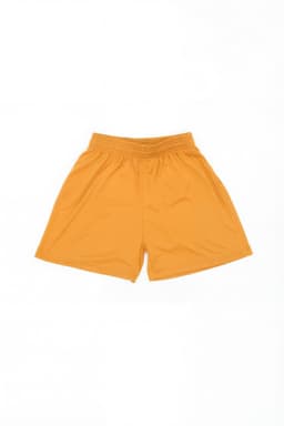 Youth Core Shorts in bright orange, featuring an elastic waistband and a simple design. It includes a logo.