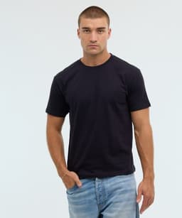 A black t-shirt displayed on a model, paired with light blue jeans. The t-shirt features a logo.