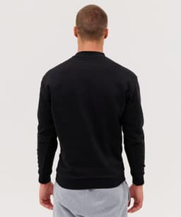 A black jumper with long sleeves, featuring a simple design and no visible front details.
