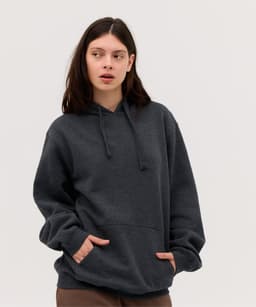 A dark grey hoodie featuring a front pocket and adjustable drawstrings. The model wears it casually with a relaxed fit.