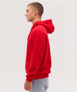 A red hoodie is displayed on a mannequin, featuring a hood and kangaroo pocket, set against a neutral background.