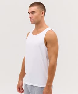 A white singlet for men displayed on a model, featuring a simple design and an unobtrusive logo.