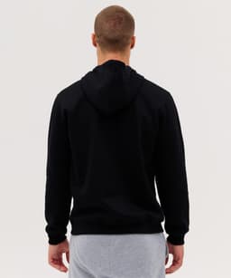 A black hoodie with a hood shown from the back, paired with grey sweatpants. The hoodie features a logo.