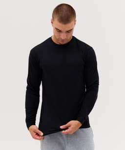A black long sleeve tee displayed on a model, featuring a fitted design and a smooth fabric finish.