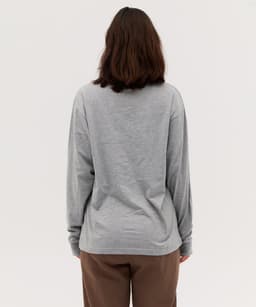 A long sleeve grey t-shirt viewed from the back, with a relaxed fit and simple design.