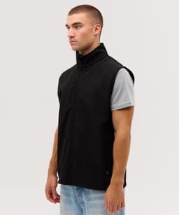 A black softshell vest with a high collar and zippered front, featuring a logo on the chest area.