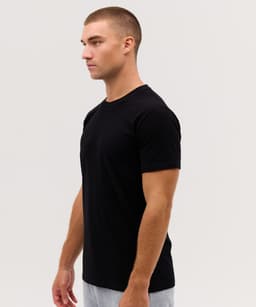 A plain black T-shirt is featured, shown on a model from the side, with a branding logo present.