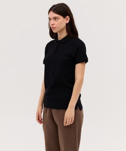 A black women's polo shirt with a collar and short sleeves, featuring a logo on the chest.