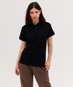 A black women's polo shirt with a classic collar and short sleeves, featuring a logo on the left side.