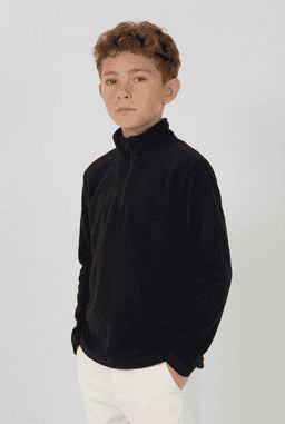 A young model wearing a black Youth Everest Polar Fleece 1/4 Zip jacket, featuring a soft fleece texture.