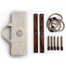 A Backyard Quoits Set featuring wooden quoits, ropes, and scoring boards in a cream carry case.