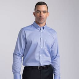 A light blue button-up shirt for men featuring long sleeves and a breast pocket, with a logo present.