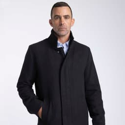 A wool jacket in black, featuring a collar and front pockets, worn by a male model with short hair.