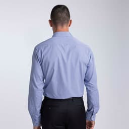 A light blue button-up shirt with long sleeves and a collar, featuring a back view and subtle branding.