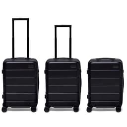 Three black hardcase suitcases with extendable handles and wheels, featuring a logo on the front.