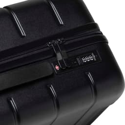 A black hardcase trolley with a zip closure and a combination lock mechanism. It features a textured surface.